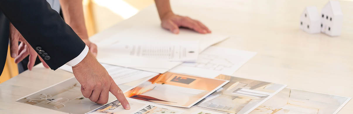 Close-up of home seller presenting advantages of property to potential buyer